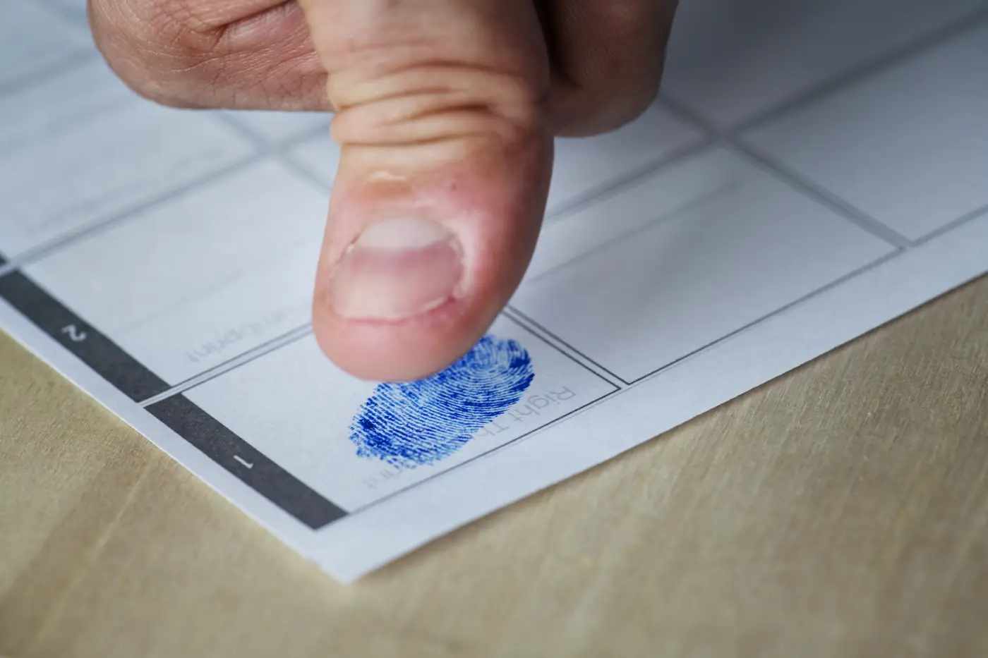 Fingerprints being taken for a police clearance application